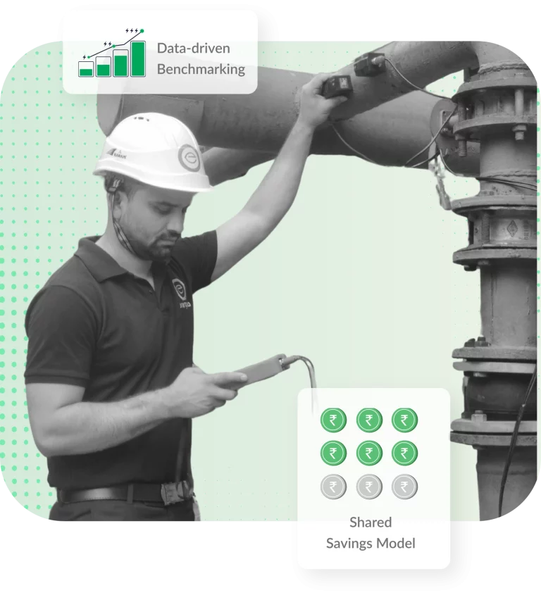 Technician measuring energy efficiency on an industrial pipeline with data-driven benchmarking indicators.
